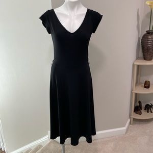 Black dress.  Small loops for optional belt